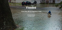 flooded neighborhood street and yards in Greenville, IL